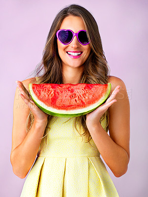 Buy stock photo Studio shot of a beautiful woman holding a watermelon against a pink background