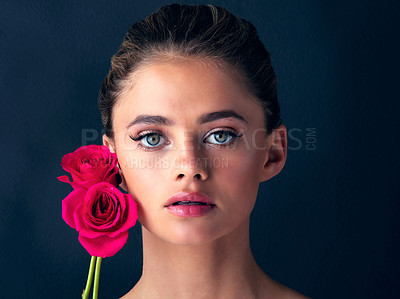 Buy stock photo Flowers, portrait or woman with skincare for beauty on black background with foundation, roses or glow. Floral, confident model or proud girl in studio with cosmetics, hydration or makeup for results