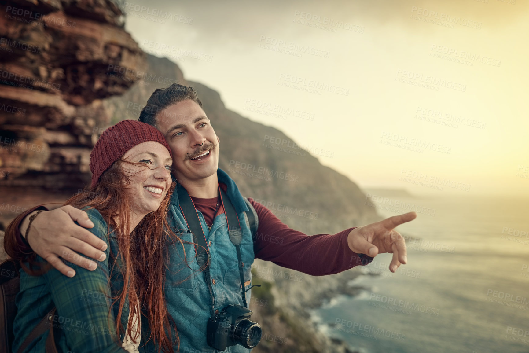 Buy stock photo Smile, couple and pointing on mountain at sea on vacation, holiday or travel together. Happy man, woman and sightseeing at cliff by ocean for adventure, journey or hiking outdoor for view of nature