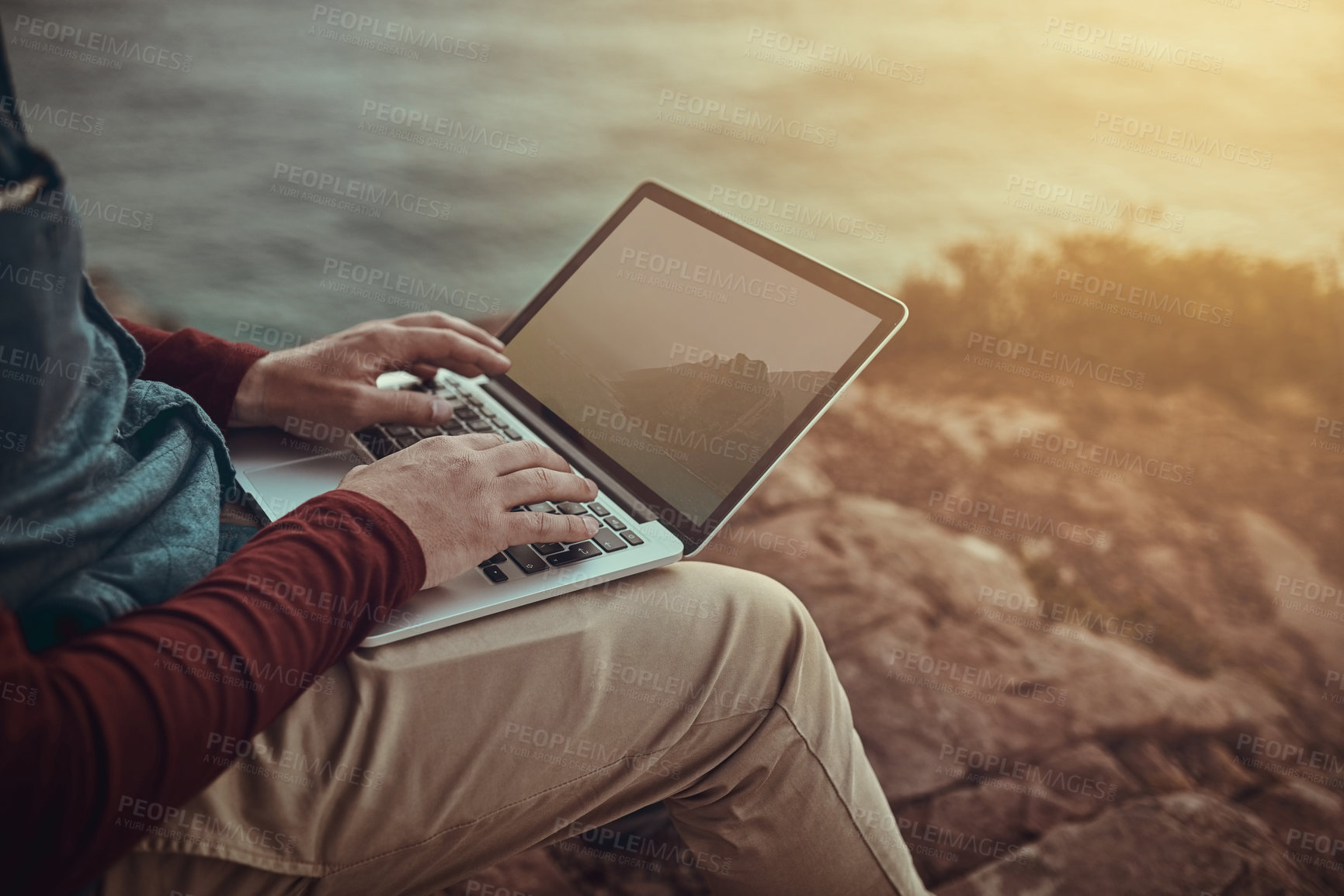 Buy stock photo Nature, laptop screen and hands of person on cliff for research, wave study or climate change. Outdoor, oceanography and scientist for renewable energy source, water depth or circulation patterns