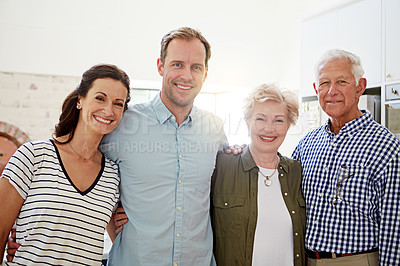 Buy stock photo Portrait of a happy married couple posing with their elderly parents at home