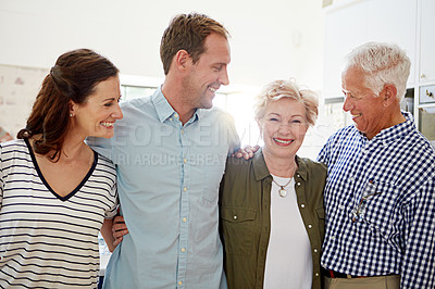 Buy stock photo Portrait of a happy married couple posing with their elderly parents at home