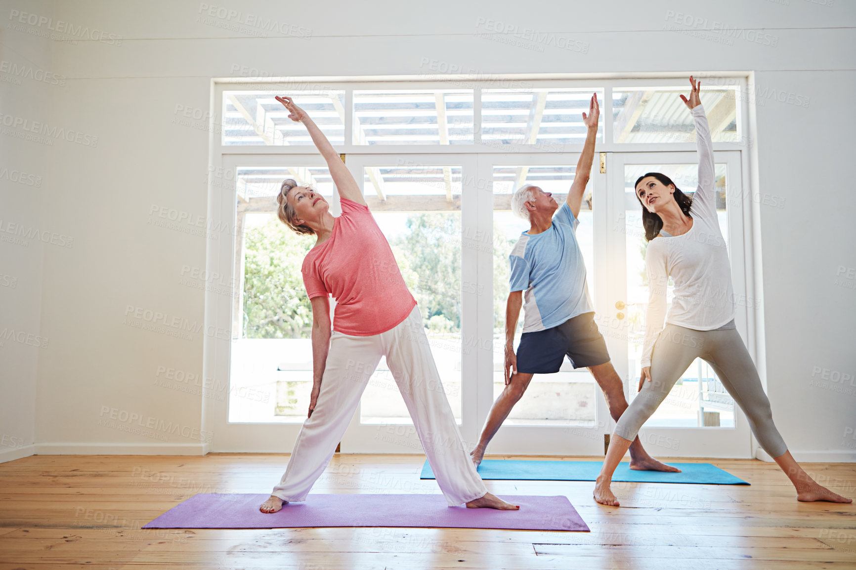 Buy stock photo Yoga, stretching and mature couple with teacher for fitness, health and wellness in pose in class. Workout, senior man and woman on mat for body care, balance and exercise together with instructor