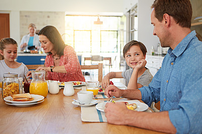 Buy stock photo Food, love and morning with a family in the dining room of their home together for health or nutrition. Mother, father and sibling children eating breakfast at a table in their apartment for bonding