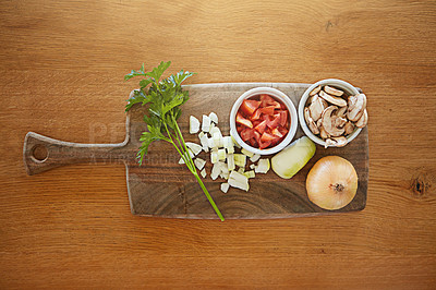 Buy stock photo High angle shot of fresh ingredients on a chopping board