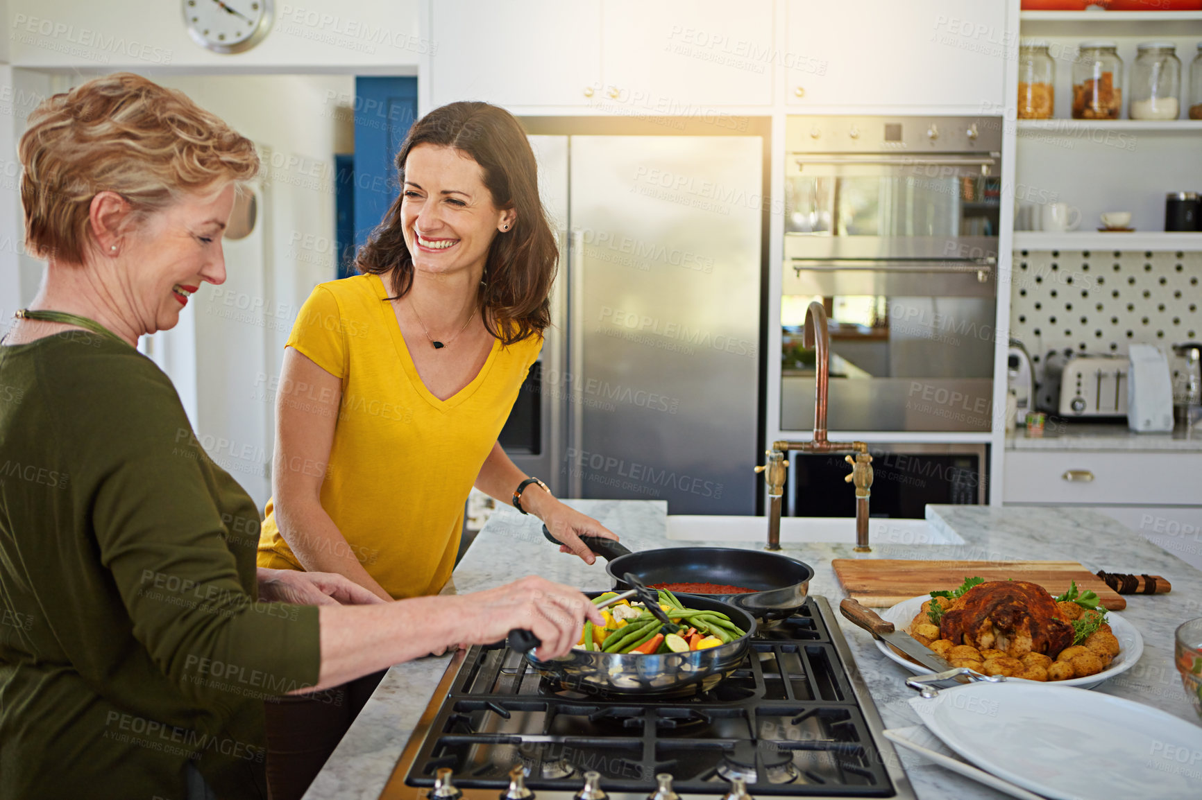 Buy stock photo Elderly woman, daughter and cooking in home with laughing, bonding and healthy meal with funny joke in kitchen. Mother, person and happy with helping, support and dinner with vegetables and nutrition