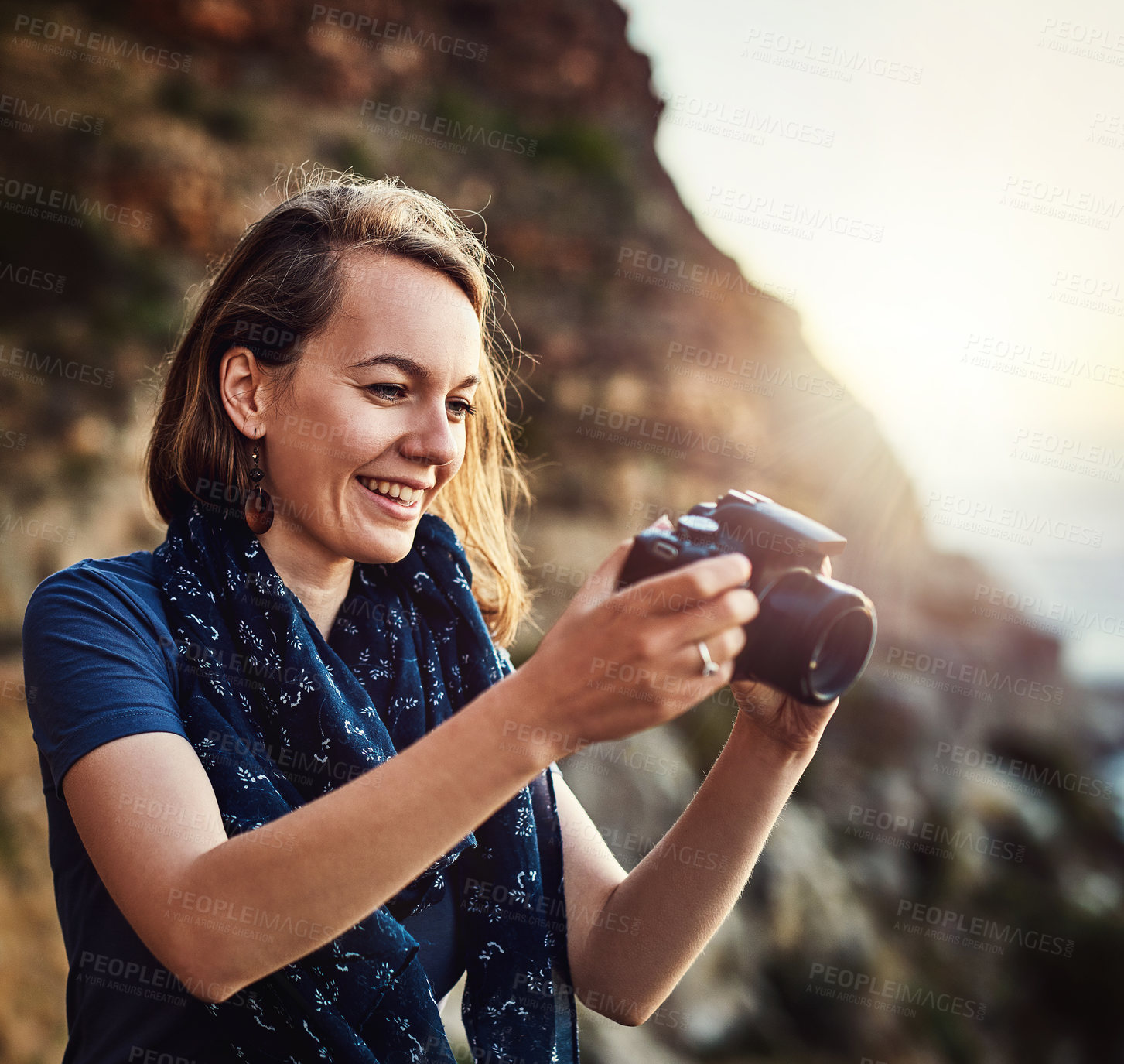 Buy stock photo Travel, photography and happy woman with camera at a beach for sunset, shooting or scenic recording in nature. Photographer, lens and ocean for digital photoshoot or sunrise, vacation or trip