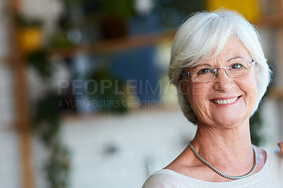 Buy stock photo Cropped portrait of a senior woman relaxing in her local coffee shop