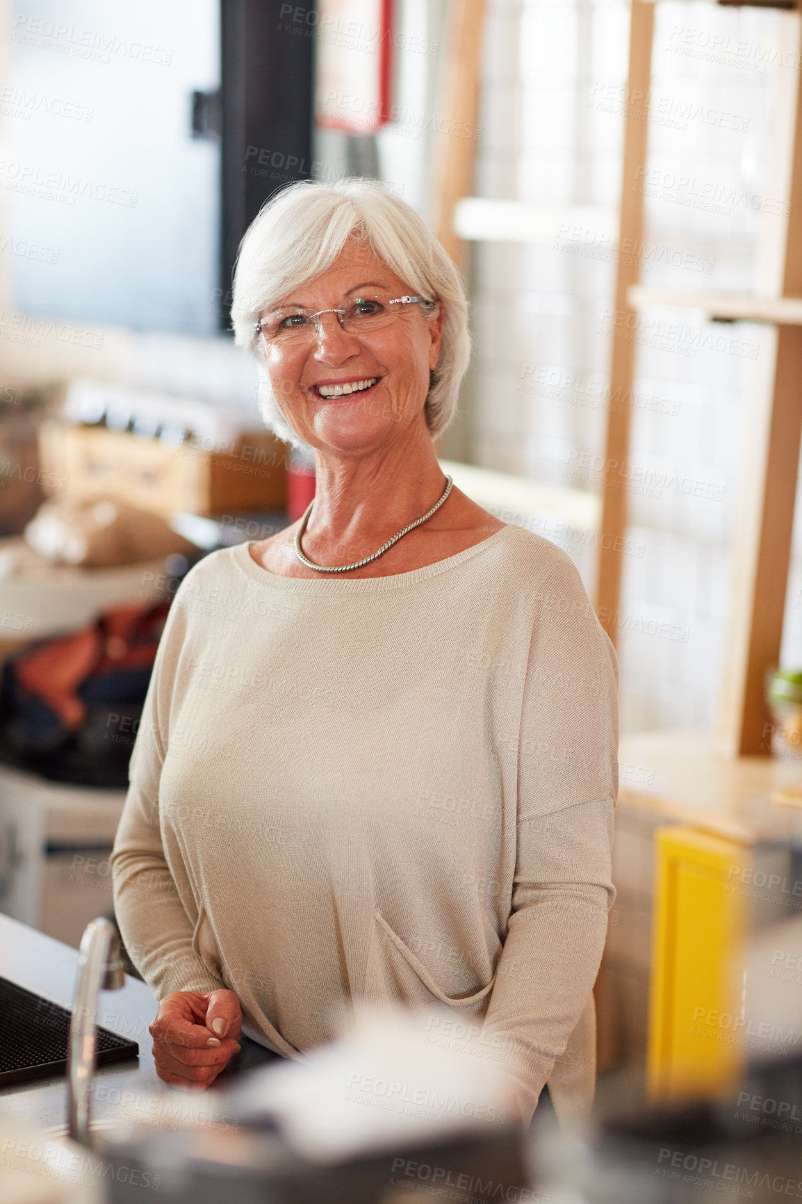 Buy stock photo Portrait of a happy senior woman managing a small business