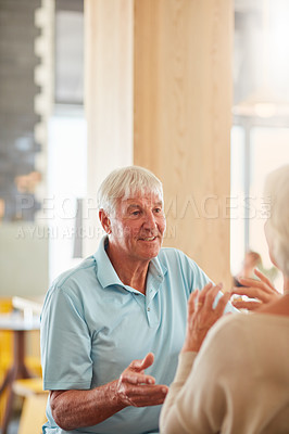 Buy stock photo Cropped shot of an affectionate senior couple in their local coffee shop