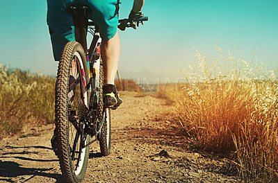 Buy stock photo Cropped shot of a man out cycling in the countryside