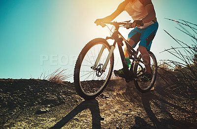 Buy stock photo Cropped shot of a man out cycling in the countryside