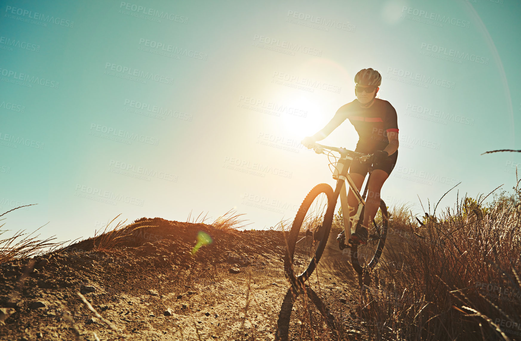 Buy stock photo Cropped shot of a man out cycling in the countryside