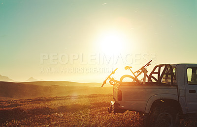 Buy stock photo Sports, sunrise and bicycle on car in nature for training, workout and exercise in countryside. Fitness, cycling and mountain bike in truck for outdoor adventure, travel journey and transportation