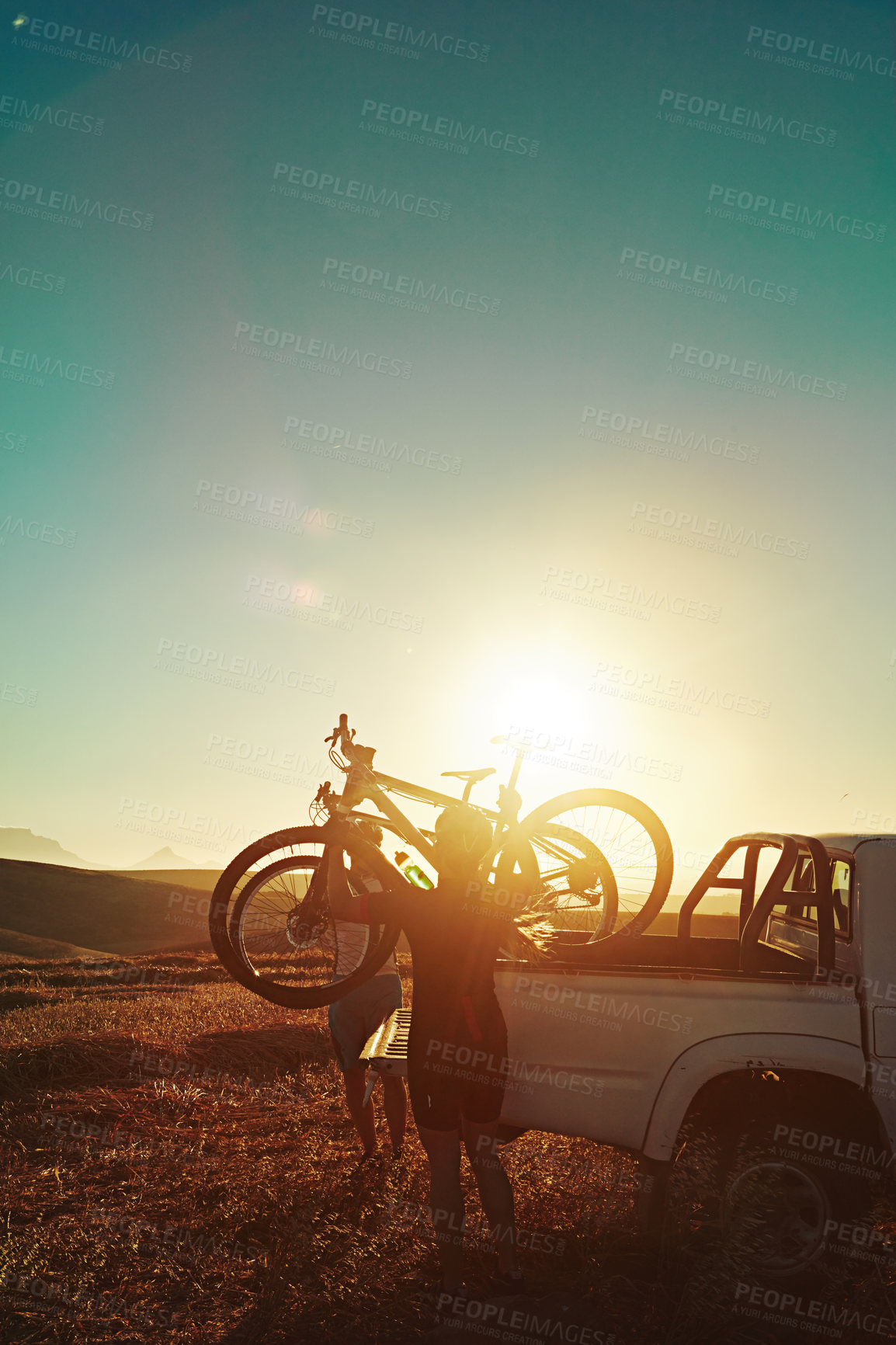 Buy stock photo Sports, sunrise and people with bicycle in car for training, workout and exercise in countryside. Fitness, cycling and friends with mountain bike in truck for adventure, travel journey and transport