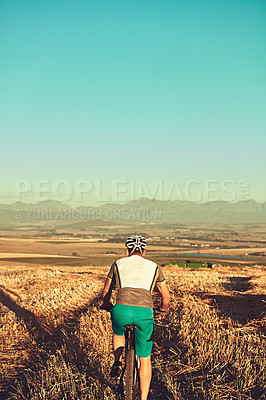 Buy stock photo Cropped shot of a man out cycling in the countryside