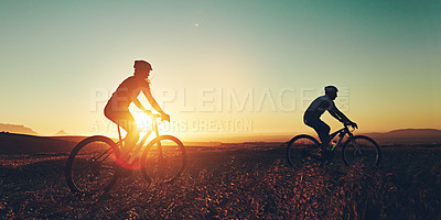 Buy stock photo Sunset sky, silhouette and people on bicycle together with adventure, race and exercise in nature. Cycling, fitness and friends with mountain bike in evening for outdoor workout, trip and grass path