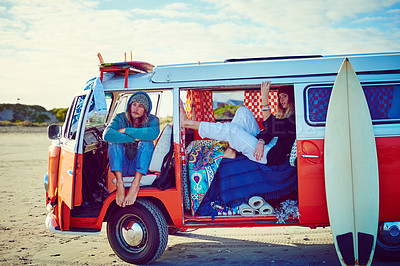 Buy stock photo Shot of an adventurous couple out roadtripping in their mini van