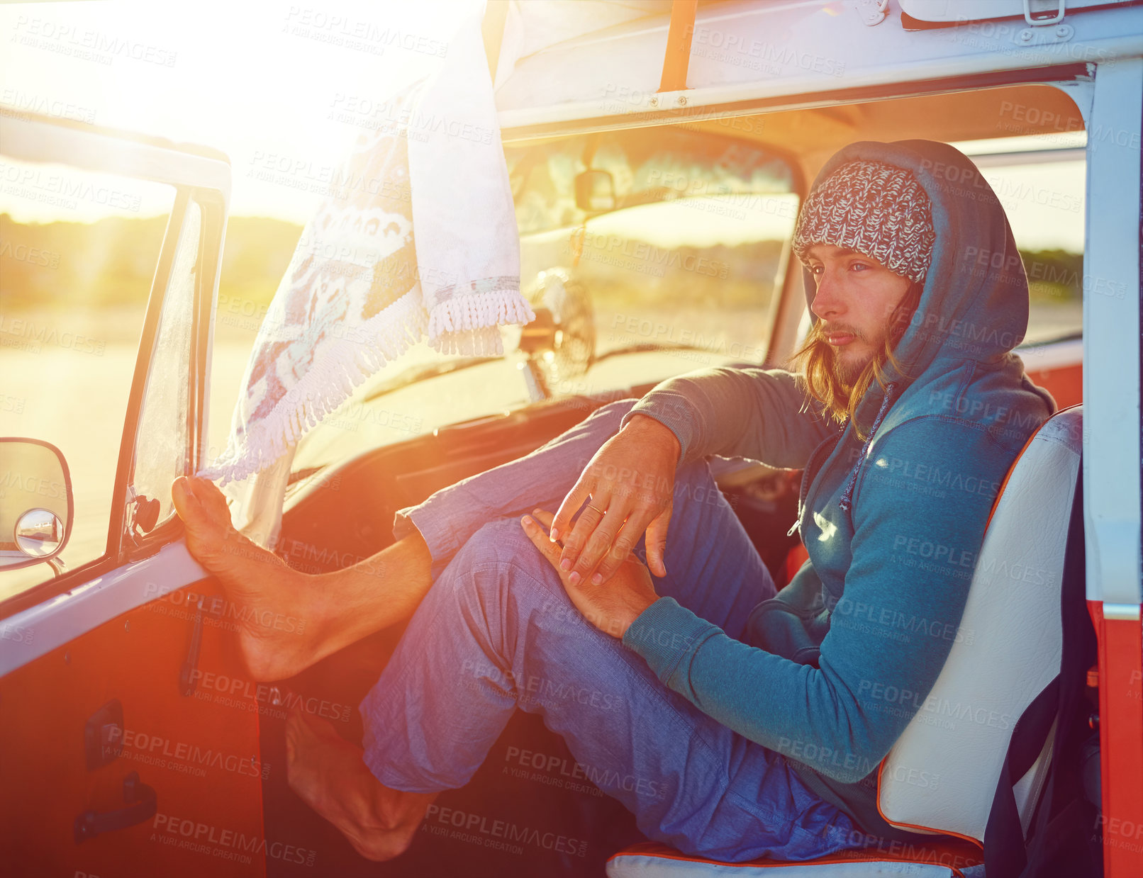 Buy stock photo Shot of a young man out roadtripping in his mini van