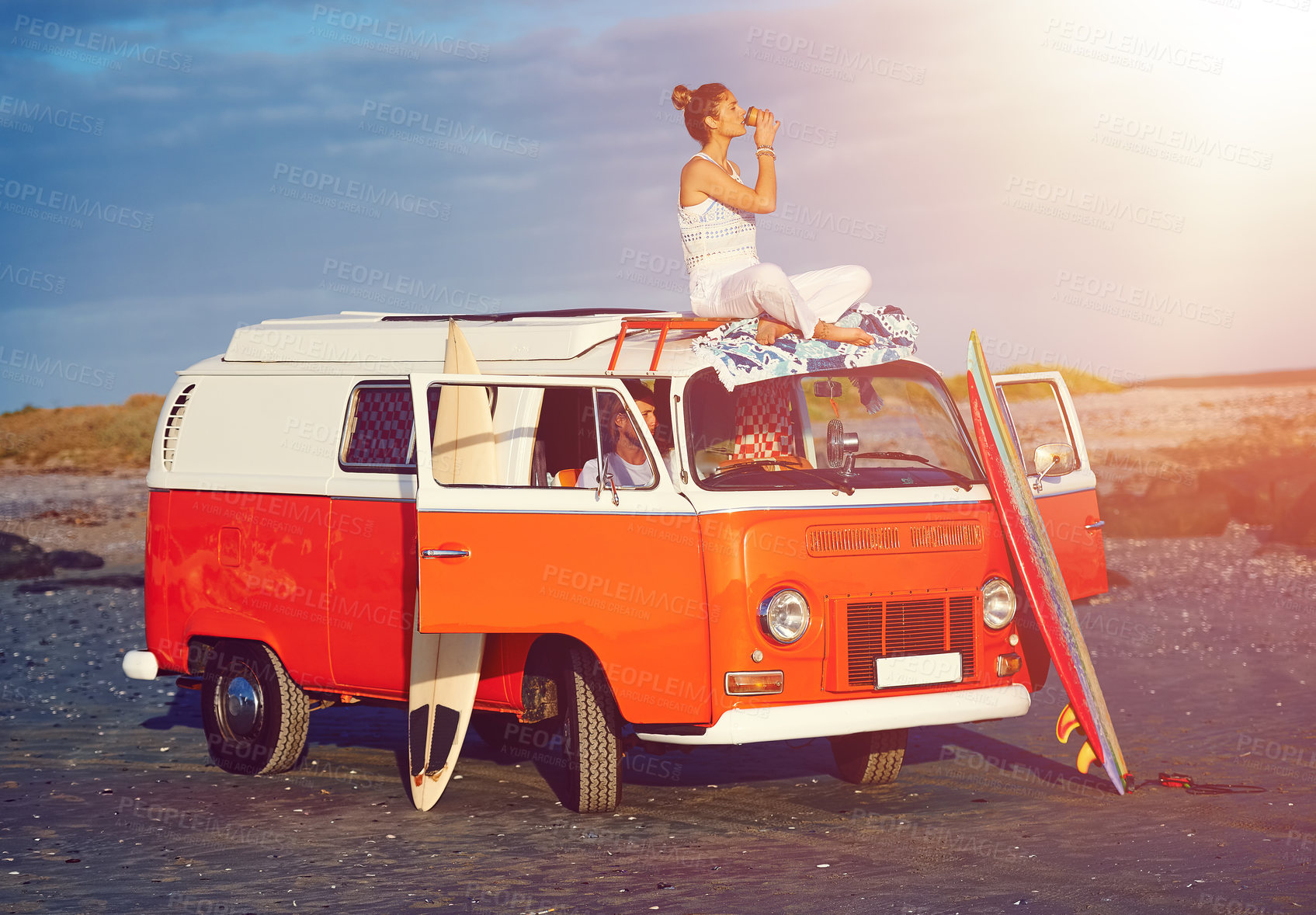 Buy stock photo Shot of an adventurous couple out roadtripping in their mini van