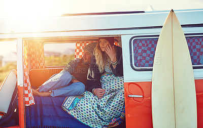 Buy stock photo Shot of an adventurous couple out roadtripping in their mini van