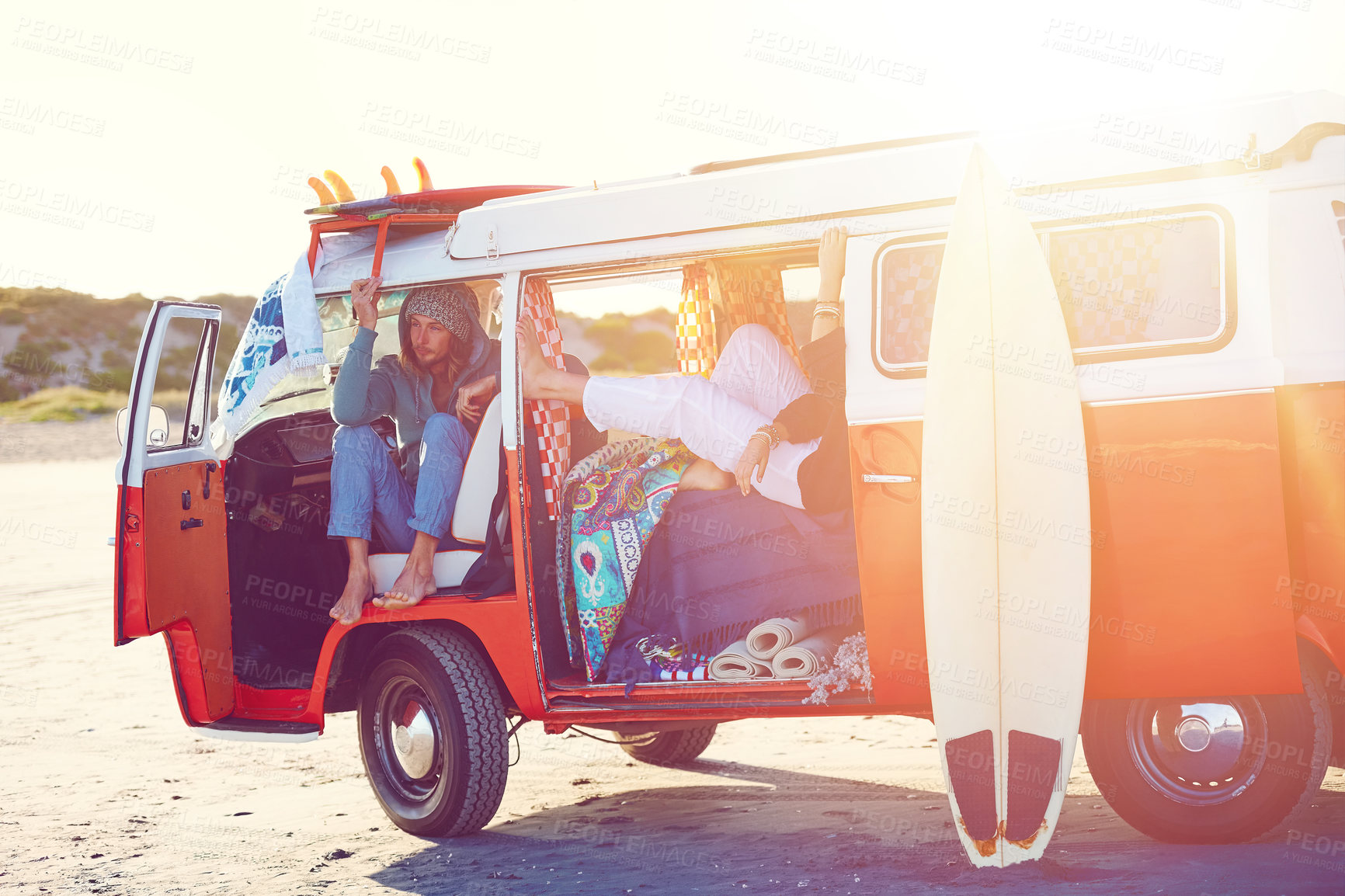 Buy stock photo Shot of an adventurous couple out roadtripping in their mini van