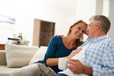 Buy stock photo Cropped shot of a mature couple relaxing together at home