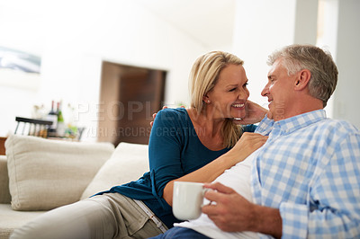 Buy stock photo Cropped shot of a mature couple relaxing together at home