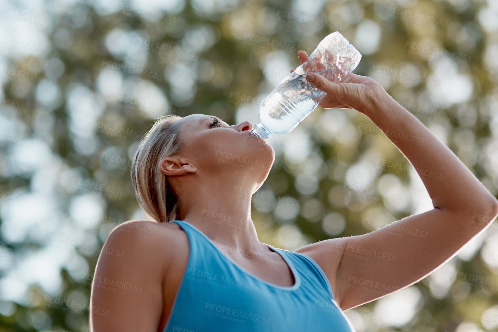 Buy stock photo Fitness, mature woman and drinking water in outdoor from exercise, hydrate and energy break after running training. Female runner, relax and refreshing liquid, recovery and health wellness of workout