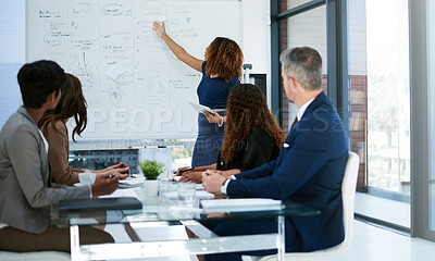 Buy stock photo Cropped shot of a young businesswoman giving a presentation in the boardroom
