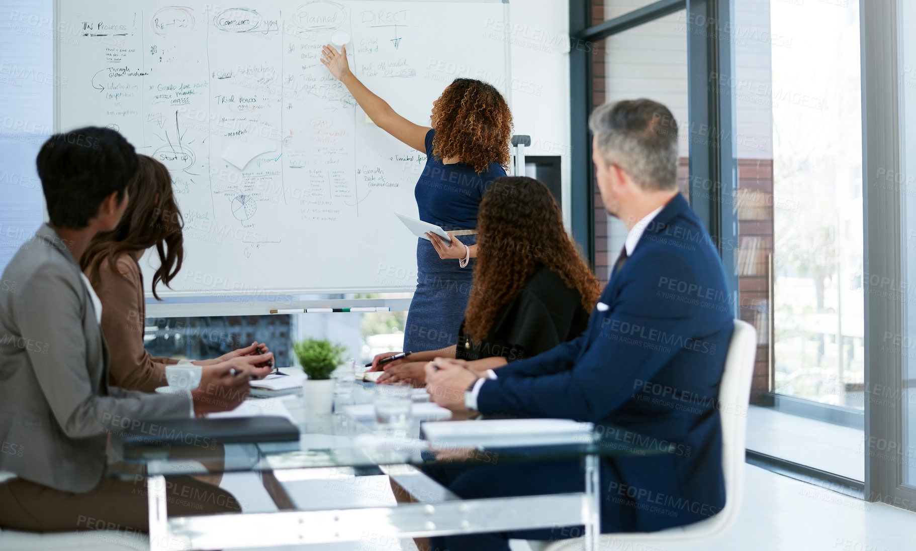 Buy stock photo Cropped shot of a young businesswoman giving a presentation in the boardroom