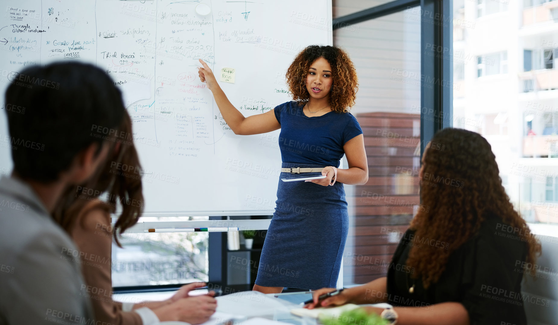 Buy stock photo Cropped shot of a young businesswoman giving a presentation in the boardroom