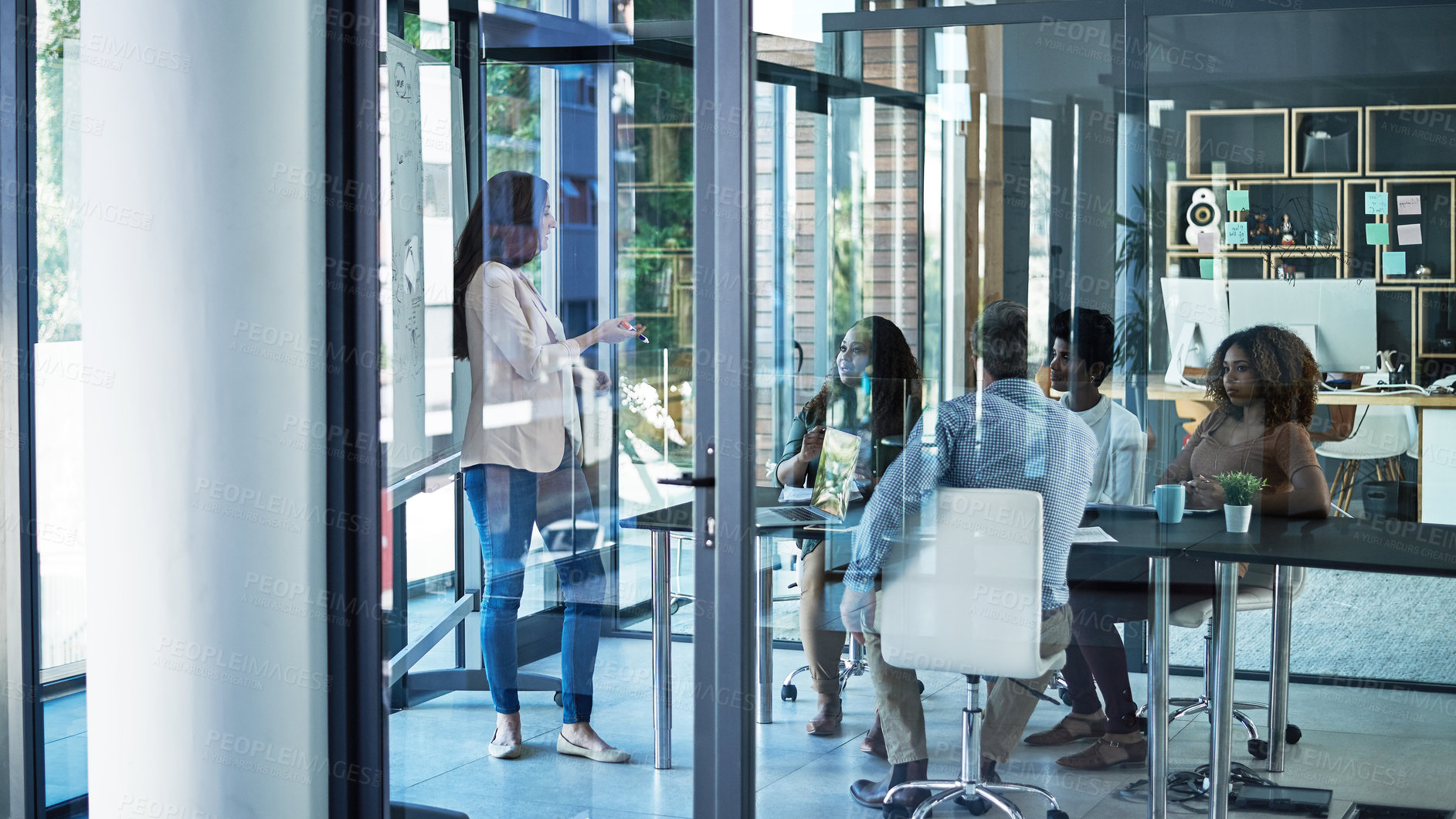 Buy stock photo Shot of a group of focussed businesspeople listening to a presentation in the boardroom