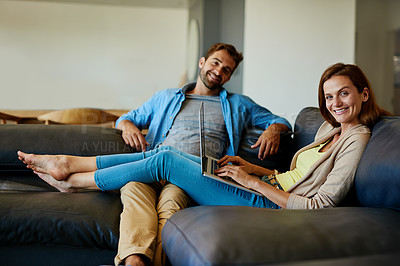 Buy stock photo Portrait of an affectionate young couple relaxing on the sofa at home