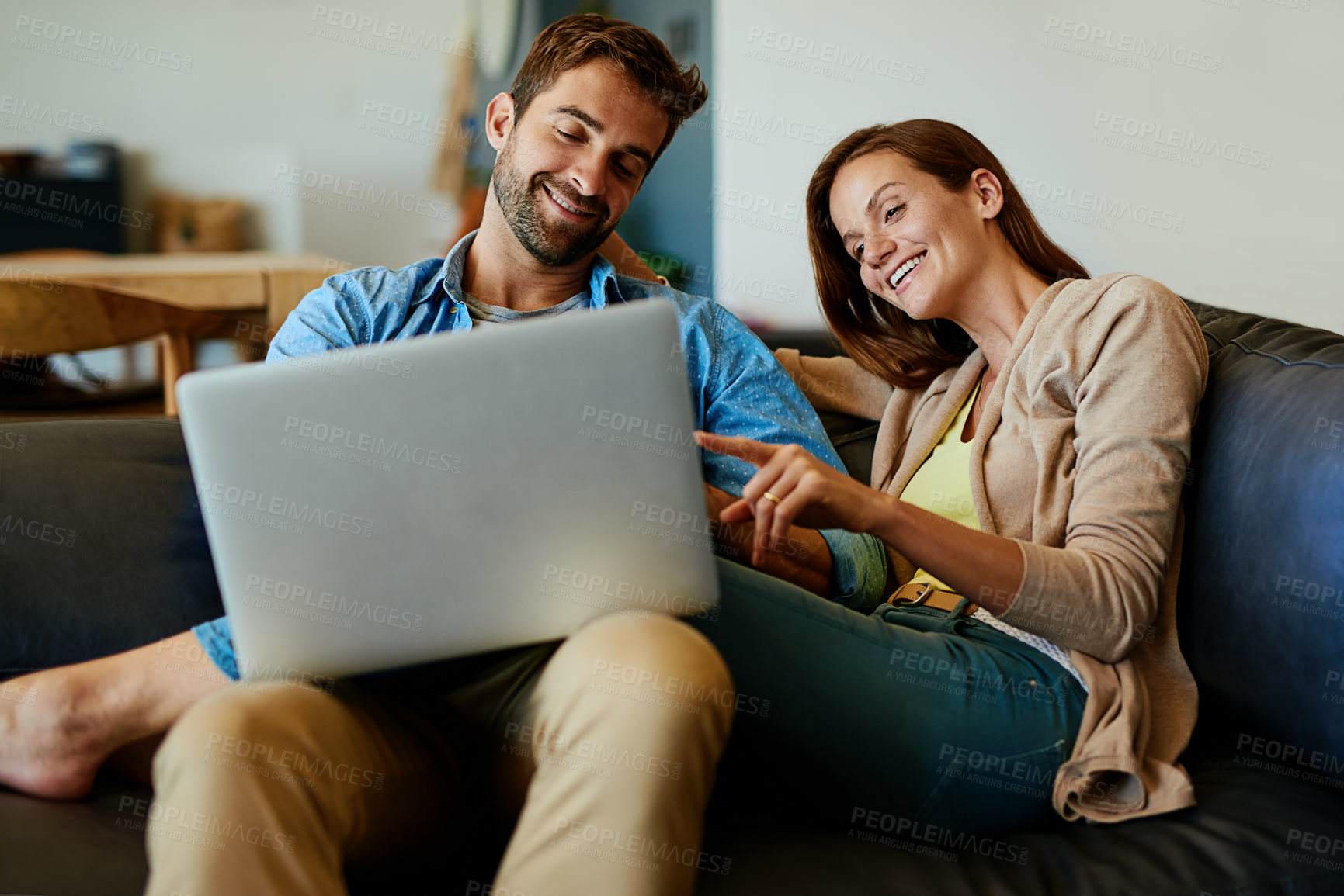 Buy stock photo Couple, laptop and relax on couch in home with social media scroll, conversation or watching movie with bonding. People, technology or happy on sofa in living room with online streaming or discussion