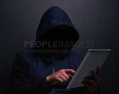 Buy stock photo Online, hacker and man with tablet in studio for cybersecurity, ransomware and scam on database. Cyber attack, crime and person with technology for coding, privacy risk or malware on black background