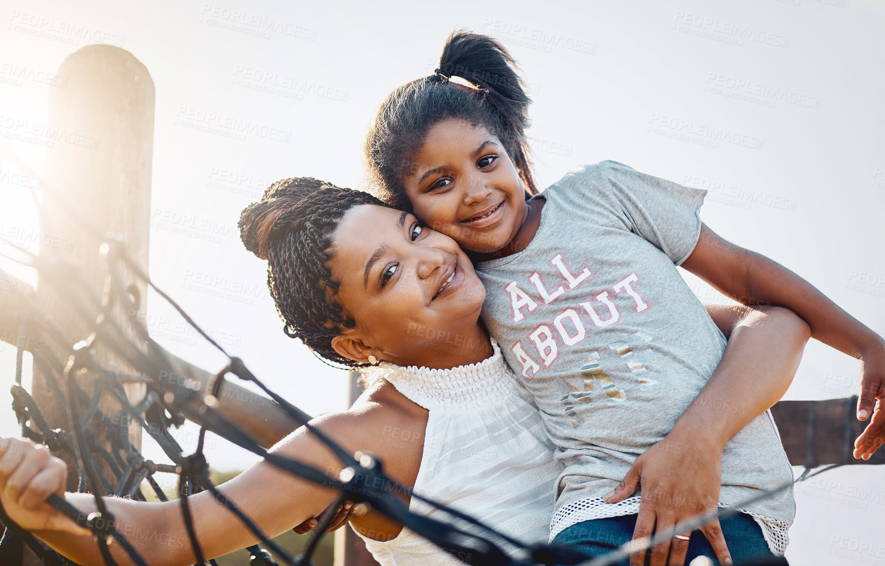 Buy stock photo Mother, hug and portrait of happy kid at playground for support, love and care with family. African mom, face and girl embrace at park for connection, adoption or play game with parent for motherhood