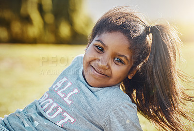 Buy stock photo Portrait of an adorable little girl enjoying some time outdoors