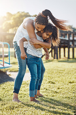 Buy stock photo Shot of a mother bonding with her daughter at the park