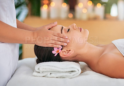 Buy stock photo Cropped shot of an attractive young woman enjoying a head massage at a spa
