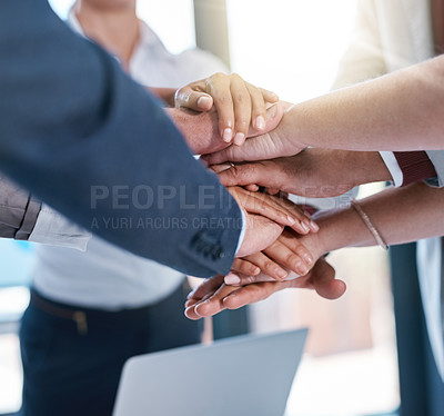 Buy stock photo Cropped shot of a group of unrecognizable businesspeople piling their hands on top of each other in the office