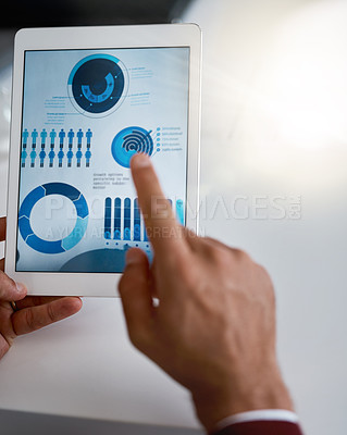 Buy stock photo Rearview shot of an unrecognizable businessmen looking at charts and graphs on his tablet in the office