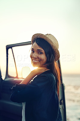 Buy stock photo Portrait, relax and road trip with woman at beach at sunset for holiday, travel or vacation in summer. Car, smile and wellness with happy tourist on coast for drive, getaway or transport to location