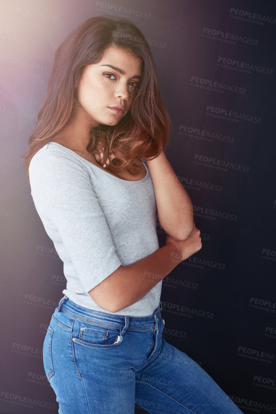 Buy stock photo Cropped portrait of a beautiful young woman posing in the studio