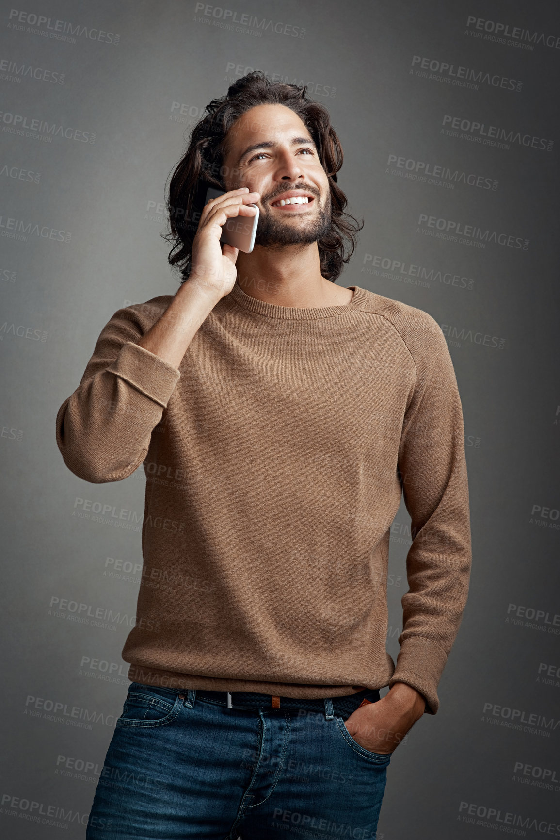 Buy stock photo Man, phone call and happy for conversation with contact, communication and speaking in studio. Male person, smile and mobile hello for discussion, gossip storytelling and network by gray background