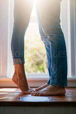 Buy stock photo Cropped shot of an unrecognizable couple kissing at home