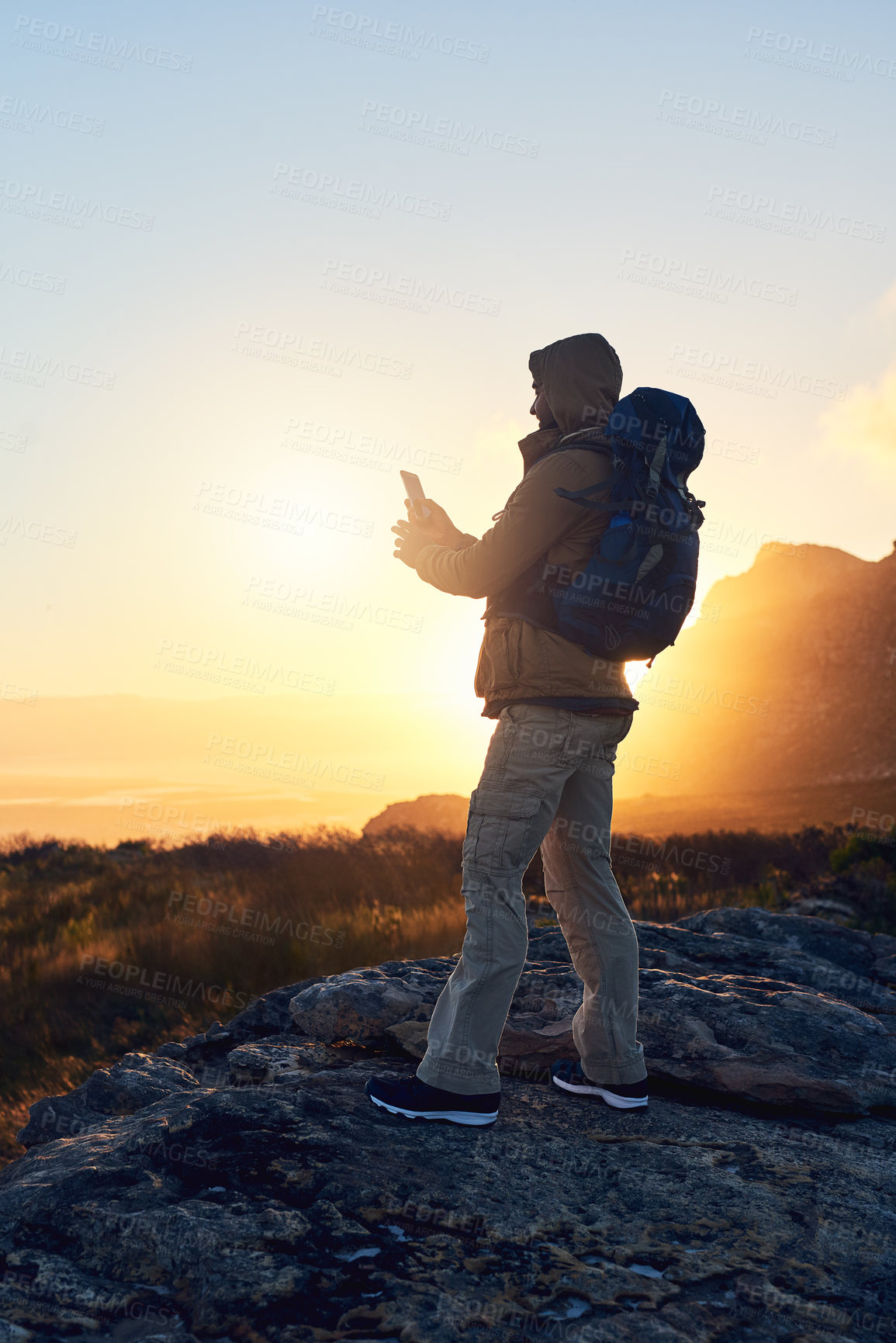 Buy stock photo Hiking, mountain and man with smartphone, picture and nature with wellness, balance and backpack. Journey, outdoor and person with cellphone, stress relief and healthy with hobby, travel or adventure