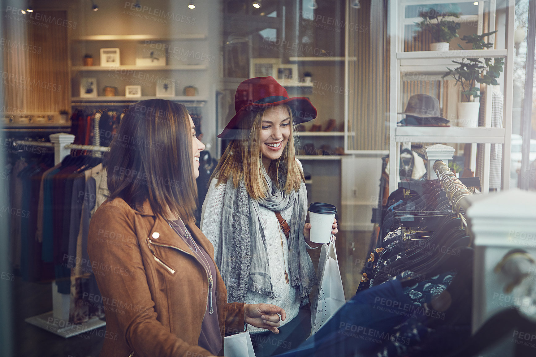 Buy stock photo Shot of two best friends out shopping in a clothing store