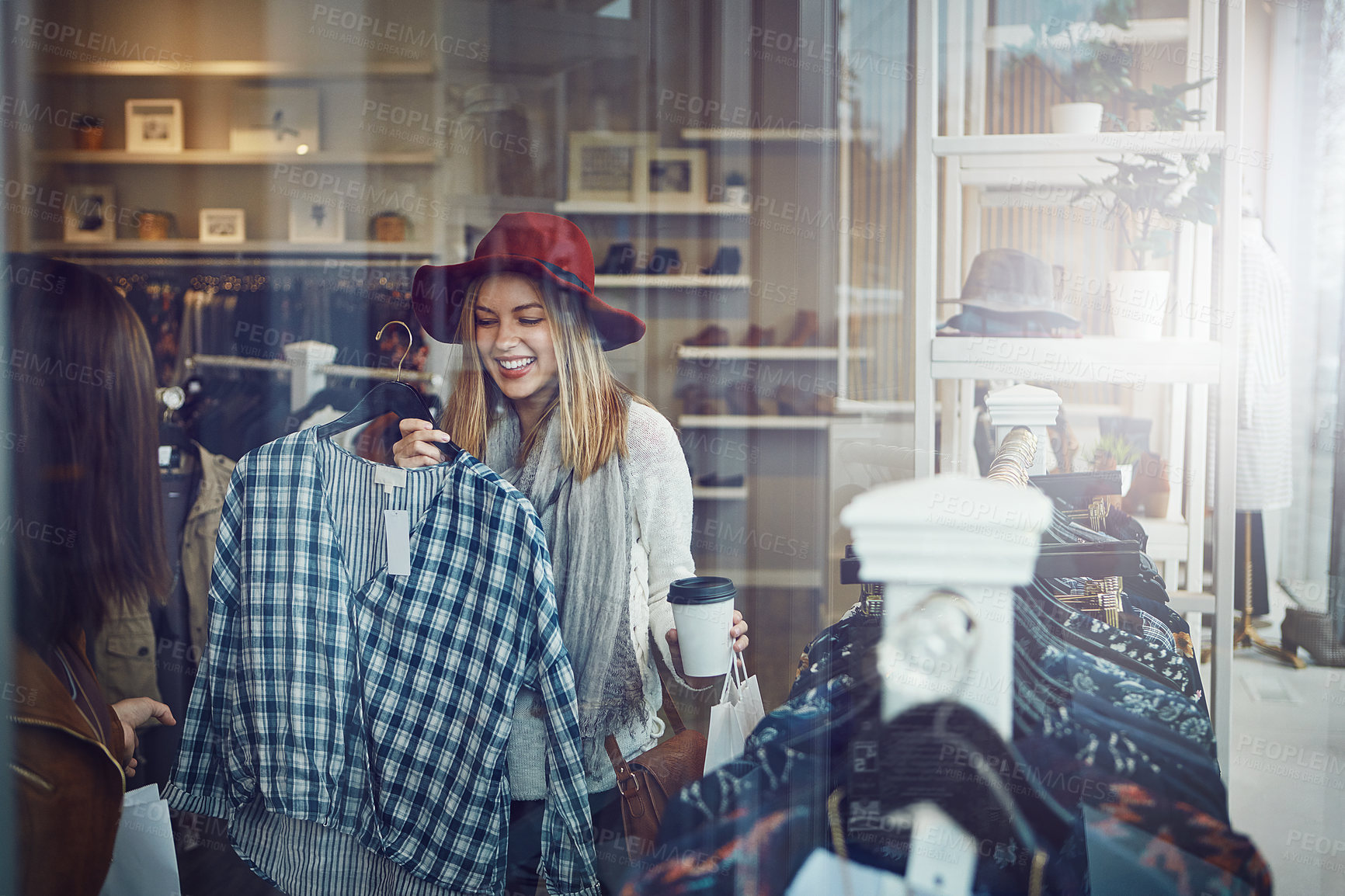 Buy stock photo Shot of two best friends out shopping in a clothing store