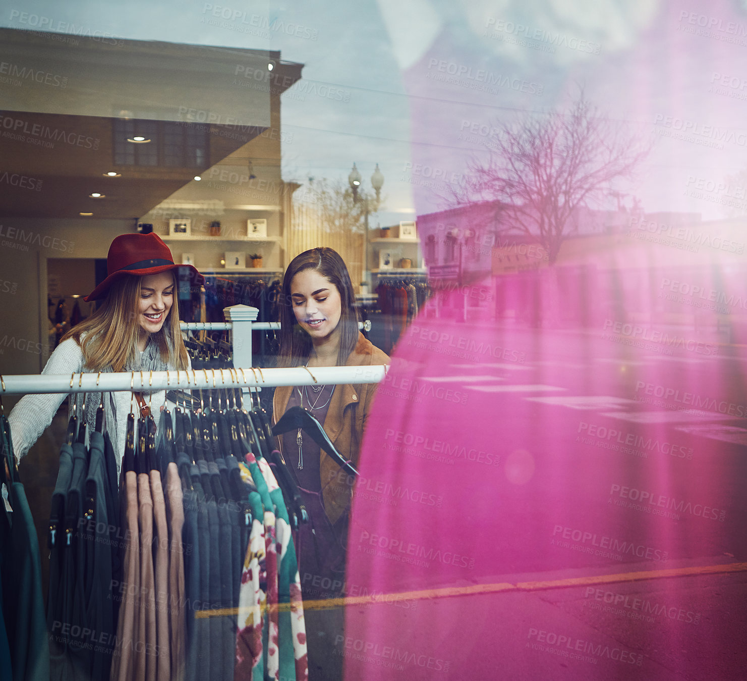 Buy stock photo Shot of two best friends out shopping in a clothing store